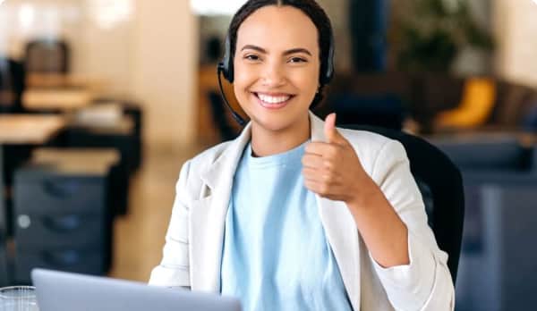 Female receptionist showing thumbs up