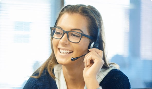 Female receptionist with spectacles smiling