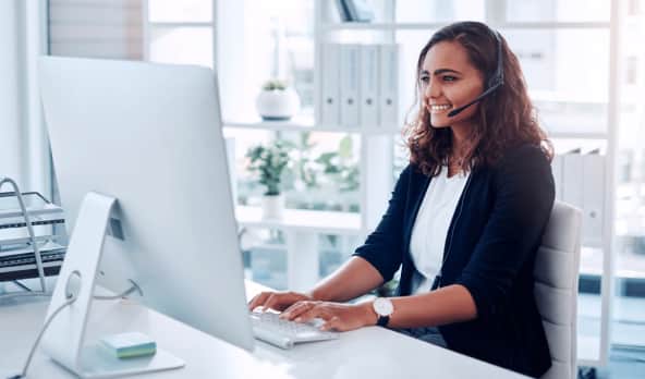 female receptionist working on a pc