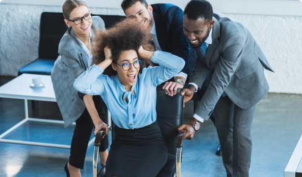 Business people helping woman in a wheelchair