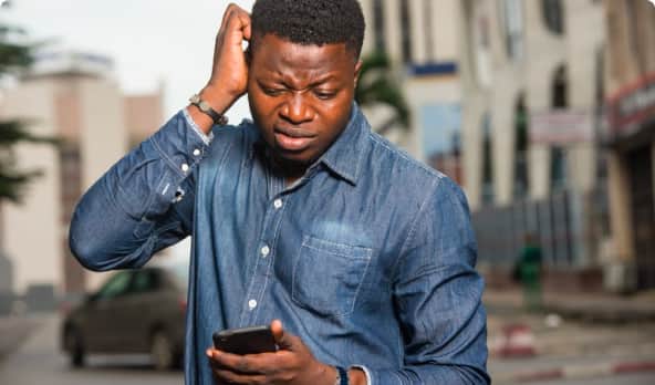 Male looking at mobile screen