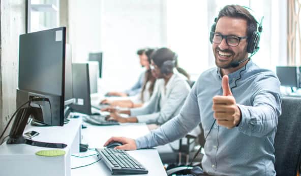 Male receptionist showing thumbs up
