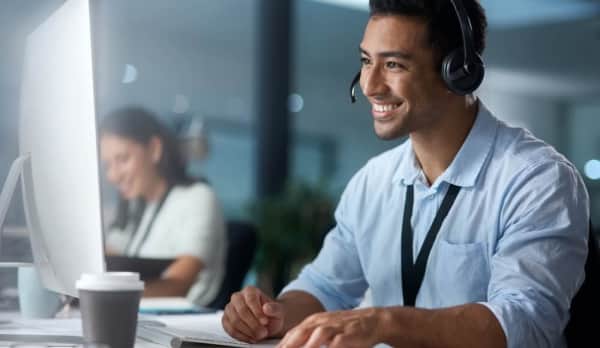 Male receptionist smiling