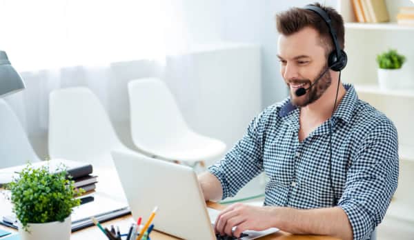 Male receptionist typing