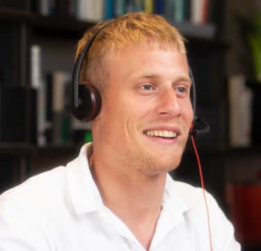 Male receptionist taking calls