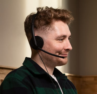 Male receptionist smiling