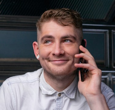 Portrait of young man taking on the phone