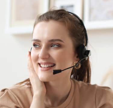Call center receptionist with headphones
