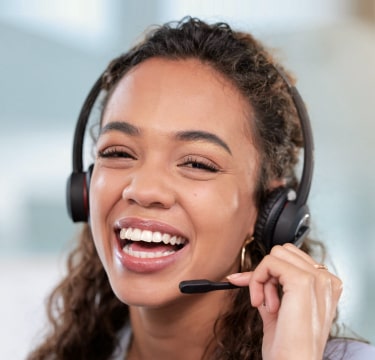 Female receptionist holding mic and smiling