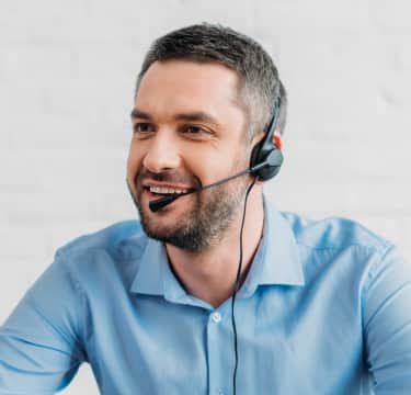 Male receptionist taking calls